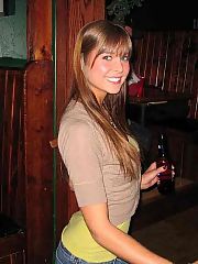 Photo 1, blackhaired teenager shows tiny