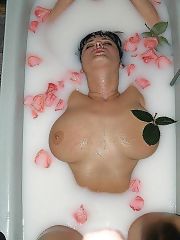 Photo 1, busty brunette sucking cock