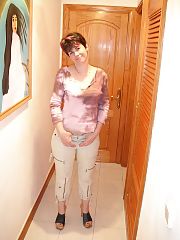 Photo 1, brunette mature stripping