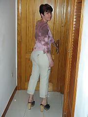 Brunette mature stripping