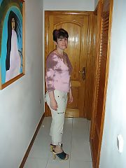 Photo 1, brunette mature stripping