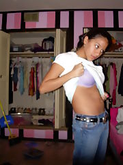 Photo 1, busty teen undresses cam