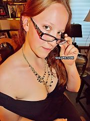 Photo 1, large breasted milf undresses