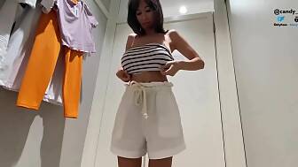 boobed masturbates public fitting