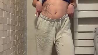 tattooed undresses bathroom